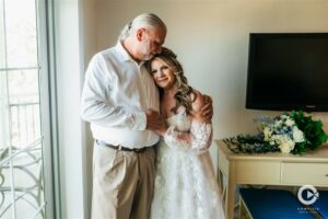 Father of the bride moments in the Tween Waters Island Resort bridal suite.